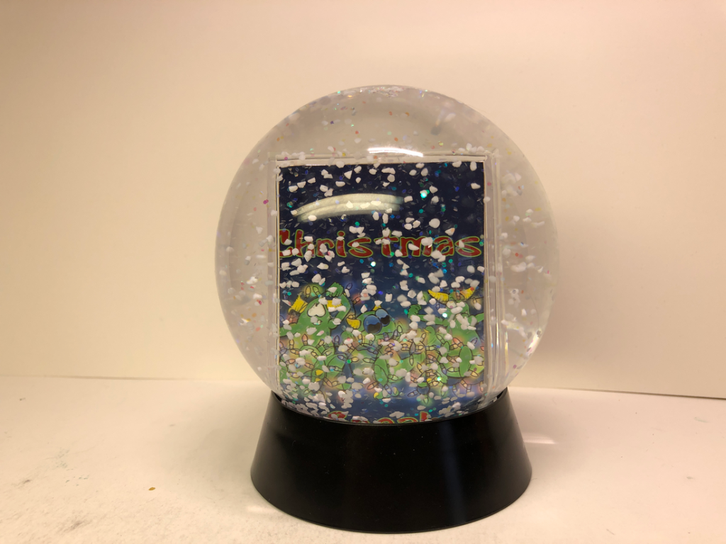 Pesky Gremlins snow globe